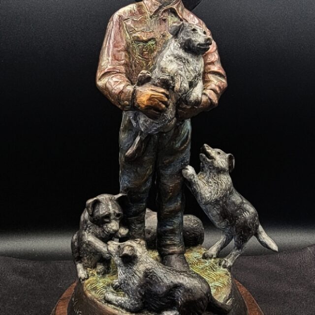 The Puppy Wrangler Bronze by Susan Kliewer