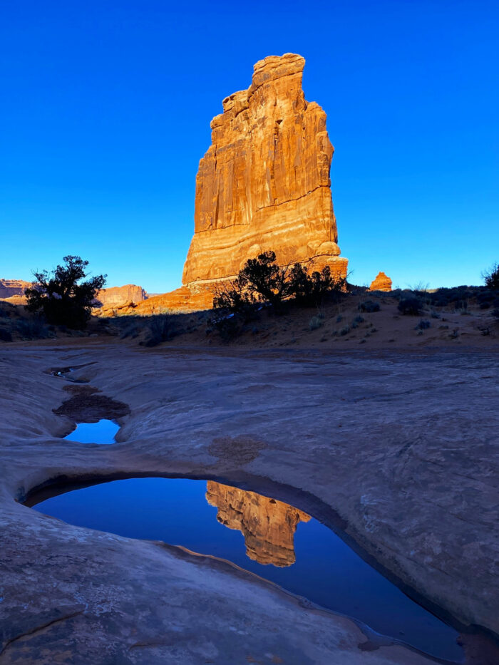 Courthouse Towers Rock and its Reflection by Iris Yang