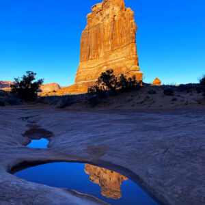 Courthouse Towers Rock and its Reflection by Iris Yang