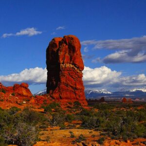 Balance Rock Against the Snowy Mountains by Iris Yang