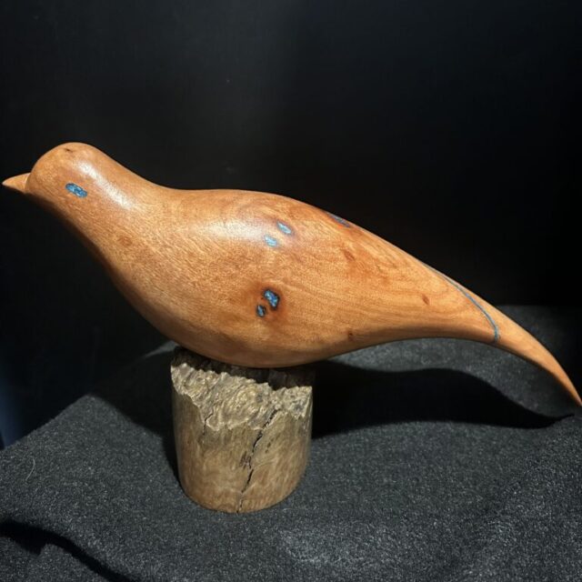 Red Bird on Pedestal by Barry Richardson