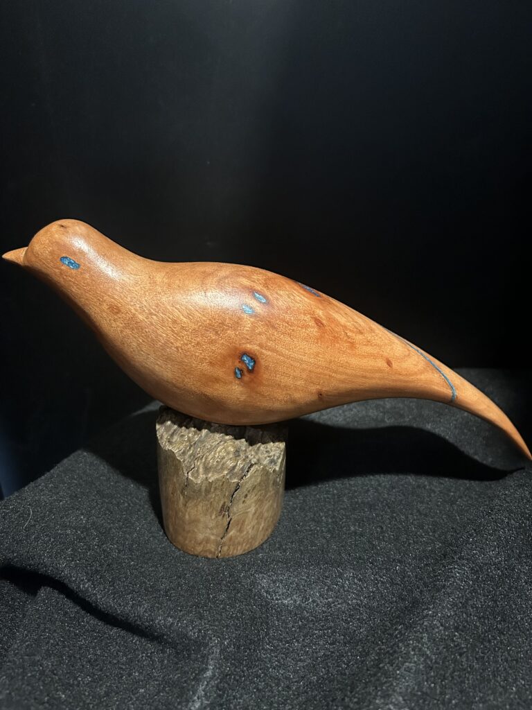 Red Bird on Pedestal by Barry Richardson